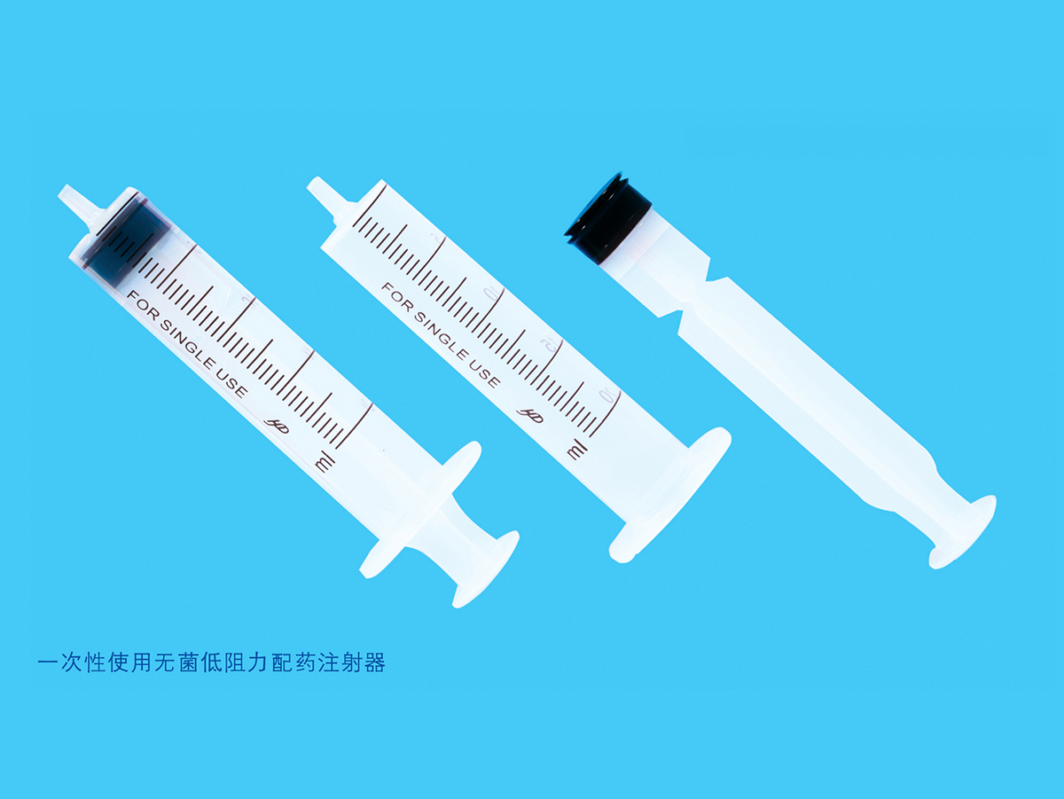 Disposable sterile low resistance dispensing syringe with needle